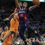Detroit Pistons guard Ish Smith (14) drives on Phoenix Suns forward Alan Williams (15) in the second half of an NBA basketball game in Auburn Hills, Mich., Sunday, March 19, 2017. (AP Photo/Paul Sancya)