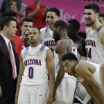 Arizona coach Sean Miller, left, speaks with his players during the second half of an NCAA college basketball game against UCLA in the semifinals of the Pac-12 men's tournament Friday, March 10, 2017, in Las Vegas. Arizona won 86-75. (AP Photo/John Locher)