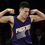 Phoenix Suns' Devin Booker (1) celebrates after scoring during the first half of the team's NBA basketball game against the Brooklyn Nets on Thursday, March 23, 2017, in New York. (AP Photo/Frank Franklin II)