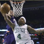Boston Celtics guard Isaiah Thomas (4) goes to the hoop against Phoenix Suns guard Devin Booker during the second half of an NBA basketball game, Friday, March 24, 2017, in Boston. The Celtics won 130-120. (AP Photo/Elise Amendola)