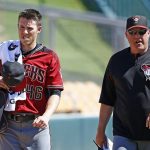 Arizona Diamondbacks starting pitcher Patrick Corbin, left, walks to the dugout with pitching coach Mike Butcher, right, after Corbin finished warming up in the bullpen prior to a spring training baseball game against the Chicago White Sox Thursday, March 9, 2017, in Glendale, Ariz. (AP Photo/Ross D. Franklin)