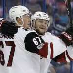 Arizona Coyotes right wing Christian Fischer (36) celebrates with left wing Lawson Crouse (67) after Fischer scored against the Tampa Bay Lightning during the first period of an NHL hockey game Tuesday, March 21, 2017, in Tampa, Fla. (AP Photo/Chris O'Meara)