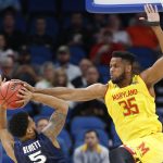 Maryland forward Damonte Dodd (35) blocks a shot from Xavier guard Trevon Bluiett (5) during the first half of the first round of the NCAA college basketball tournament, Thursday, March 16, 2017 in Orlando, Fla. (AP Photo/Wilfredo Lee)