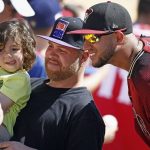 Arizona Diamondbacks right fielder David Peralta, right, poses for a picture with some fans prior to a spring training baseball game against the Chicago White Sox, Thursday, March 9, 2017, in Glendale, Ariz. (AP Photo/Ross D. Franklin)