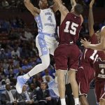 North Carolina's Isaiah Hicks (4) shoots over Texas Southern's Stephan Bennett (15) during the second half in a first-round game of the NCAA men's college basketball tournament in Greenville, S.C., Friday, March 17, 2017. (AP Photo/Chuck Burton)