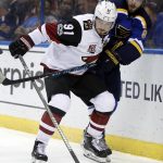 Arizona Coyotes' Alexander Burmistrov, of Russia, and St. Louis Blues' Joel Edmundson, right, chase after a loose puck during the third period of an NHL hockey game, Monday, March 27, 2017, in St. Louis. The Blues won 4-1. (AP Photo/Jeff Roberson)