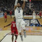 Villanova guard Josh Hart (3) drives to the basket against Wisconsin guard Khalil Iverson (21) during the first half of a second-round men's college basketball game in the NCAA Tournament, Saturday, March 18, 2017, in Buffalo, N.Y. (AP Photo/Bill Wippert)