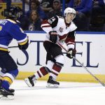 Arizona Coyotes' Clayton Keller (14) handles the puck as St. Louis Blues' Jaden Schwartz watches during the first period of an NHL hockey game, Monday, March 27, 2017, in St. Louis. (AP Photo/Jeff Roberson)