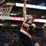 Portland Trail Blazers center Jusuf Nurkic (27) shoots past Phoenix Suns guard Devin Booker during the first quarter of an NBA basketball game, Sunday, March 12, 2017, in Phoenix. (AP Photo/Rick Scuteri)