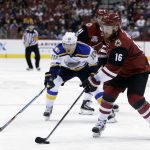 Arizona Coyotes left wing Max Domi (16) skates with the puck in front of St. Louis Blues right wing Scottie Upshall in the second period during an NHL hockey game, Wednesday, March 29, 2017, in Glendale, Ariz. (AP Photo/Rick Scuteri)