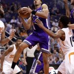 Sacramento Kings forward Skal Labissiere (3) rebounds as Phoenix Suns guard Ronnie Price (14) looks on during the first half of an NBA basketball game, Wednesday, March 15, 2017, in Phoenix. (AP Photo/Matt York)