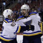 St. Louis Blues center Patrik Berglund (21) celebrates with David Perron after scoring a goal in the first period during an NHL hockey game against the Arizona Coyotes, Wednesday, March 29, 2017, in Glendale, Ariz. (AP Photo/Rick Scuteri)