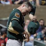 Oakland Athletics' Sonny Gray wipes his face after giving up a three-run home run to Arizona Diamondbacks' Ketel Marte during the first inning of a spring training baseball game Tuesday, March 7, 2017, in Scottsdale, Ariz. (AP Photo/Darron Cummings)