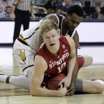 Stanford's Michael Humphrey (10) and Arizona State's Andre Adams scramble for the ball during the first half of an NCAA college basketball game in the first round of the Pac-12 men's tournament Wednesday, March 8, 2017, in Las Vegas. (AP Photo/John Locher)