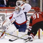 Arizona Coyotes' Alexander Burmistrov (91) scores a goal against Washington Capitals' Braden Holtby, left, during the first period of an NHL hockey game Friday, March 31, 2017, in Glendale, Ariz. (AP Photo/Ross D. Franklin)