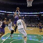 Phoenix Suns guard Devin Booker (1) shoots against the Boston Celtics during the first quarter of an NBA basketball game, Friday, March 24, 2017, in Boston. Booker scored 70 points, but the Celtics won 130-120. Booker is just the sixth player in NBA history to score 70 or more points in a game. (AP Photo/Elise Amendola)