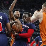 Detroit Pistons guard Reggie Jackson (1) pulls down a rebound against the Phoenix Suns in the first half of an NBA basketball game in Auburn Hills, Mich., Sunday, March 19, 2017. (AP Photo/Paul Sancya)
