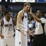 Dallas Mavericks guard Devin Harris (34), guard Wesley Matthews (23) and forward Dirk Nowitzki (41) argue a foul called by referee Mitchell Ervin (27) on Matthews, during the second half of the team's NBA basketball game against the Phoenix Suns in Dallas, Saturday, March 11, 2017. The Suns defeated the Mavericks 100-98. (AP Photo/Michael Ainsworth)