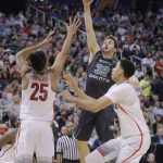 North Dakota forward Conner Avants (32) shoots as Arizona forward Keanu Pinder (25) defends during the first half of a first-round game in the NCAA men's college basketball tournament Thursday, March 16, 2017, in Salt Lake City. (AP Photo/Rick Bowmer)