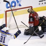 St. Louis Blues right wing Vladimir Tarasenko (91) celebrates a goal by teammate defenseman Alex Pietrangelo against Arizona Coyotes goalie Mike Smith (41) as Coyotes defenseman Luke Schenn (2) pauses near the goalie during the first period of an NHL hockey game Saturday, March 18, 2017, in Glendale, Ariz. (AP Photo/Ross D. Franklin)