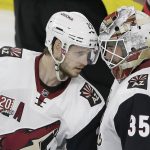 Arizona Coyotes' Oliver Ekman-Larsson (23), of Sweden, congratulates goalie Louis Domingue (35) following an NHL hockey game against the Carolina Hurricanes in Raleigh, N.C., Friday, March 3, 2017. (AP Photo/Gerry Broome)