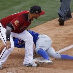 Chicago Cubs' John Andreoli, right, steals third base ahead of the tag by Arizona Diamondbacks' Carlos Rivero during the seventh inning of a spring training baseball game Thursday, March 23, 2017, in Scottsdale, Ariz. The game ended in a 5-5 tie. (AP Photo/Ross D. Franklin)
