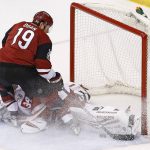 Arizona Coyotes right wing Shane Doan collides with Detroit Red Wings goalie Petr Mrazek (34) as Doan attempts a shot during the first period of an NHL hockey game Thursday, March 16, 2017, in Glendale, Ariz. (AP Photo/Ross D. Franklin)