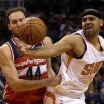 Phoenix Suns forward Jared Dudley and Washington Wizards guard Bojan Bogdanovic (44) battle for a loose ball in the second quarter during an NBA basketball game, Tuesday, March 7, 2017, in Phoenix. (AP Photo/Rick Scuteri)