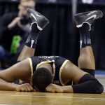 Wichita State center Shaquille Morris (24) lays on the floor following a foul during the second half of a second-round game against Kentucky in the men's NCAA college basketball tournament in Indianapolis, Sunday, March 19, 2017. Kentucky defeated Wichita State 65-62. (AP Photo/Michael Conroy)