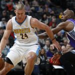 Denver Nuggets center Mason Plumlee, left, drives the lane to the rim as Sacramento Kings forward Anthony Tolliver defends in the first half of an NBA basketball game Monday, March 6, 2017, in Denver. (AP Photo/David Zalubowski)