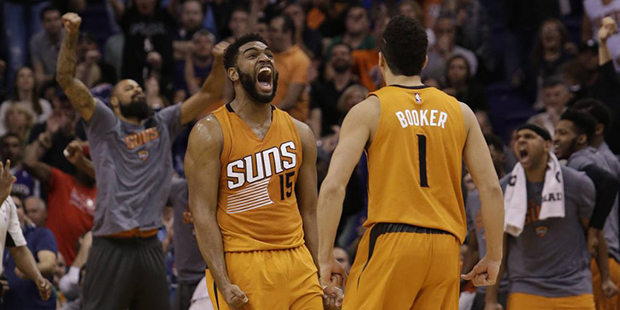 Phoenix Suns forward Alan Williams (15) celebrates with Devin Booker during an NBA basketball game ...