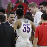 Arizona coach Sean Miller speaks with his players during the second half of an NCAA college basketball game against UCLA in the semifinals of the Pac-12 men's tournament Friday, March 10, 2017, in Las Vegas. Arizona won 86-75. (AP Photo/John Locher)