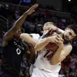 Arizona center Dusan Ristic, right, grabs a rebound next to Xavier forward Tyrique Jones (0) during the first half of an NCAA Tournament college basketball regional semifinal game Thursday, March 23, 2017, in San Jose, Calif. (AP Photo/Tony Avelar)