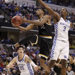 Wichita State's Markis McDuffie (32) heads to the basket past Kentucky's Bam Adebayo (3) and Derek Willis (35) during the second half of a second-round game in the men's NCAA college basketball tournament Sunday, March 19, 2017, in Indianapolis. Kentucky won 65-62. (AP Photo/Jeff Roberson)