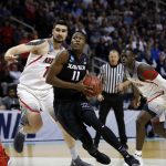 Xavier guard Malcolm Bernard (11) drives to the basket against Arizona during the first half of an NCAA Tournament college basketball regional semifinal game Thursday, March 23, 2017, in San Jose, Calif. (AP Photo/Tony Avelar)