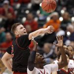 Louisville's Mangok Mathiang, right, and Jacksonville State's Norbertas Giga reach for a rebound during the second half of a first-round game in the men's NCAA college basketball tournament Friday, March 17, 2017, in Indianapolis, Mo. Louisville won 78-63. (AP Photo/Jeff Roberson)