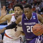 Northwestern guard Scottie Lindsey (20) drives around Gonzaga forward Johnathan Williams (3) during the first half of a second-round game in the NCAA men's college basketball tournament Saturday, March 18, 2017, in Salt Lake City. (AP Photo/Rick Bowmer)