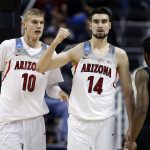 Arizona center Dusan Ristic (14) celebrates after scoring with teammate Lauri Markkanen (10) during an NCAA Tournament college basketball regional semifinal game against against Xavier Thursday, March 23, 2017, in San Jose, Calif. (AP Photo/Tony Avelar)
