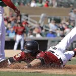 Arizona Diamondbacks' A.J. Pollock dives back to first during the first inning of an exhibition baseball game against Mexico, Wednesday, March 8, 2017, in Scottsdale, Ariz. (AP Photo/Darron Cummings)