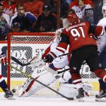 Arizona Coyotes' Alexander Burmistrov (91) scores a goal against Washington Capitals' Braden Holtby, middle, as Captials' Andre Burakovsky (65) and Lars Eller (20) look on during the first period of an NHL hockey game Friday, March 31, 2017, in Glendale, Ariz. (AP Photo/Ross D. Franklin)