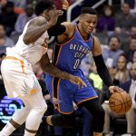 Oklahoma City Thunder guard Russell Westbrook (0) drives past Phoenix Suns guard Eric Bledsoe during the first half of an NBA basketball game, Friday, March 3, 2017, in Phoenix. (AP Photo/Matt York)