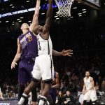 Brooklyn Nets' Quincy Acy (13) drives past Phoenix Suns' Alex Len (21) during the first half of an NBA basketball game Thursday, March 23, 2017, in New York. (AP Photo/Frank Franklin II)