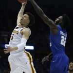 Minnesota's Amir Coffey shoots past Middle Tennessee State's JaCorey Williams during the second half of an NCAA college basketball tournament first round game Thursday, March 16, 2017, in Milwaukee. (AP Photo/Kiichiro Sato)