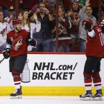 Arizona Coyotes' Josh Jooris, left, celebrates his goal against the Washington Capitals with Anthony Duclair (10) during the first period of an NHL hockey game Friday, March 31, 2017, in Glendale, Ariz. (AP Photo/Ross D. Franklin)