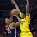 Arizona guard Allonzo Trier (35) draws the foul from Arizona State guard Shannon Evans II during the first half of an NCAA college basketball game, Saturday, March 4, 2017, in Tempe, Ariz. (AP Photo/Rick Scuteri)