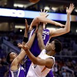 Phoenix Suns forward Marquese Chriss gets a shot off as Sacramento Kings forward Skal Labissiere (3) defends during the second half of an NBA basketball game, Wednesday, March 15, 2017, in Phoenix. (AP Photo/Matt York)