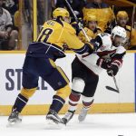 Arizona Coyotes left wing Anthony Duclair (10) is checked by Nashville Predators right wing James Neal (18) during the first period of an NHL hockey game Monday, March 20, 2017, in Nashville, Tenn. (AP Photo/Mark Humphrey)