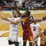 Southern Methodist forward Ben Moore, left, shoots as Southern California forward Chimezie Metu (4) defends in the second half of a first-round game in the men's NCAA college basketball tournament in Tulsa, Okla., Friday, March 17, 2017. Southern California won 66-65. (AP Photo/Sue Ogrocki)