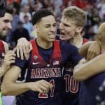 Arizona's Dusan Ristic, Chance Comanche and Lauri Markkanen, from left, celebrate after Arizona defeated Oregon 83-80 in an NCAA college basketball game for the championship of the Pac-12 men's tournament Saturday, March 11, 2017, in Las Vegas. (AP Photo/John Locher)