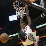 Miami Heat's Hassan Whiteside (21) dunks during the second half of an NBA basketball game against the Phoenix Suns, Tuesday, March 21, 2017, in Miami. The Heat won 112-97. (AP Photo/Lynne Sladky)